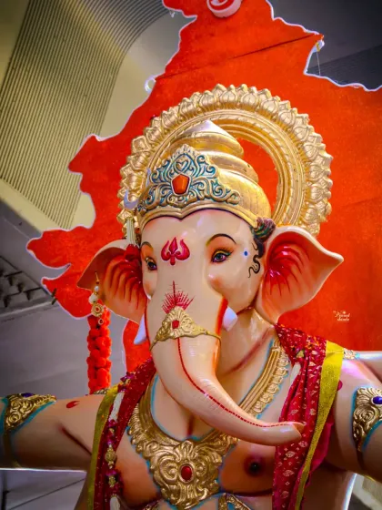 A close-up view of the divine face of a Ganpati murti I sculpted. The intricate details on the trunk, the expressive eyes, and the golden mukut are all handcrafted to create a powerful and serene presence.