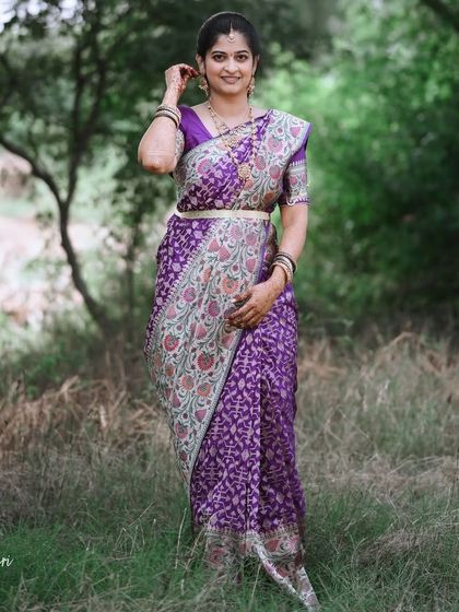 A gorgeous client in a classic Banarasi-Paithani fusion silk saree, a unique and artistic choice.