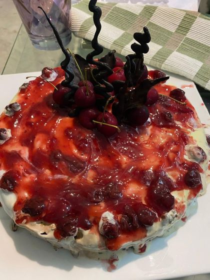 A stunning Black Forest cake, perfect for a birthday or anniversary celebration. We adorn our cakes with fresh cherries, rich cream, and elegant chocolate spirals.
