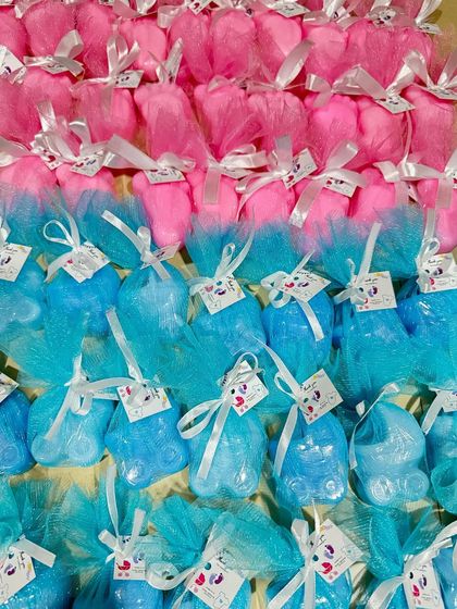 A large batch of baby shower return favors, ready for delivery. I can create these in any color to match your theme, ensuring a memorable gift for your guests.