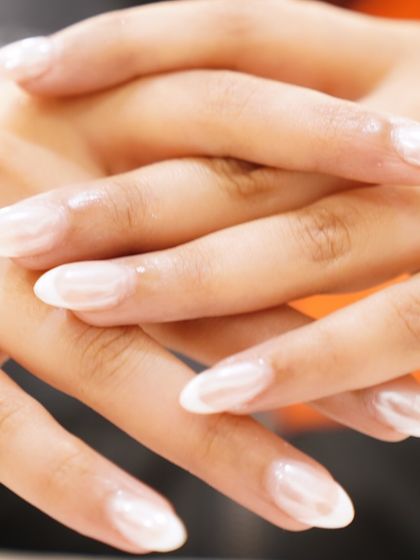 A modern classic. Our French chrome nail art offers a stunning, reflective finish that redefines elegance for your fingertips.