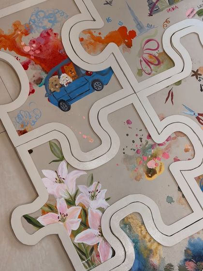 This section of the puzzle art highlights a love for flowers and road trips. I use acrylics to paint these detailed scenes, ensuring each part of your story is represented beautifully.