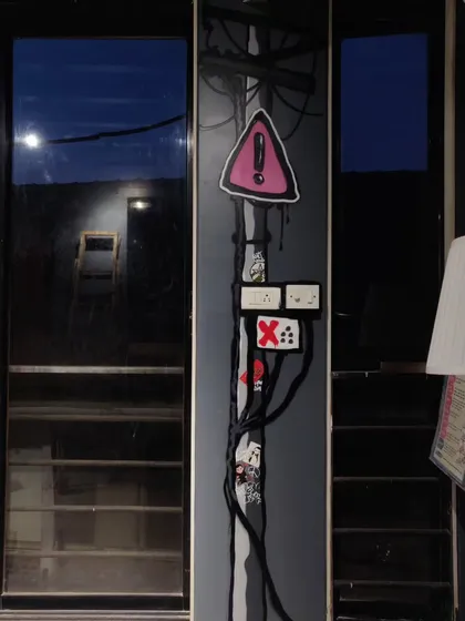 I painted this stylized electric pole on a pillar inside the Projekt Street store. It's a fun way to incorporate urban elements into an interior space, complete with warning signs and tangled wires.