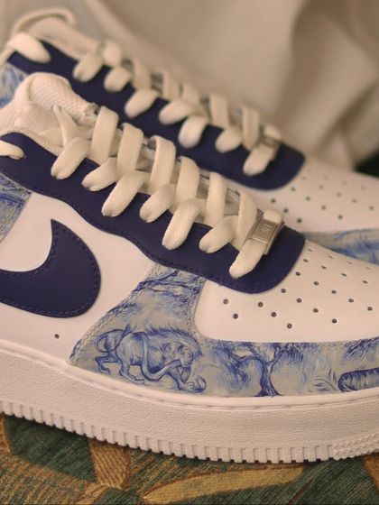 Another look at the custom Dior print AF1s. The intricate, hand-painted animal and jungle scene gives the sneakers a touch of elegance and sophistication.