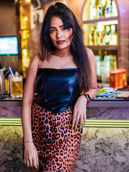 A guest posing by the bar. The venues I choose are always trendy and make for great photo opportunities.