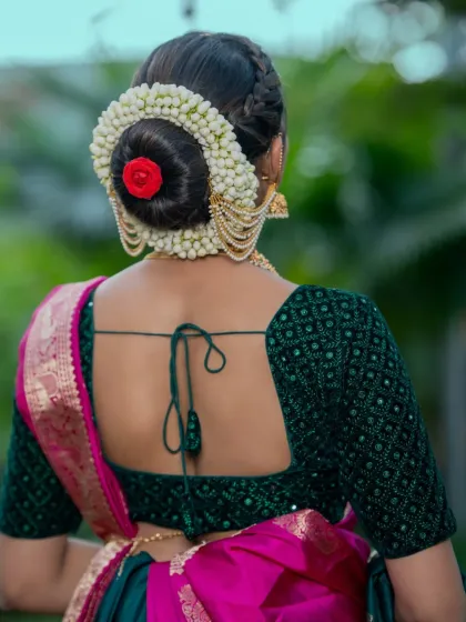 A classic bridal hairstyle is timeless. Here, I’ve created a neat, traditional bun adorned with fragrant mallige hoovu (jasmine), a signature element for many South Indian brides. This style holds perfectly through long ceremonies and looks elegant from every angle.