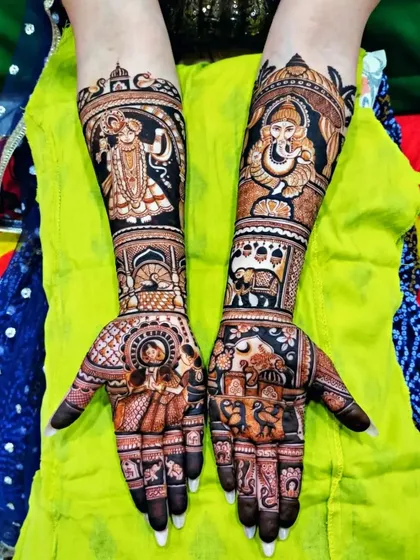 A powerful design featuring portraits of Lord Krishna and Lord Ganesha on the arms, with a bride and groom on the palms.