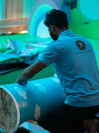 Every detail is carefully crafted. Here, a member of the setup team works on the decorations for a Peppa Pig themed party.
