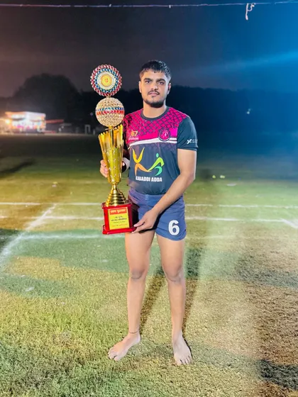 One of my players with the winner's trophy after our victory in Ghaziabad.