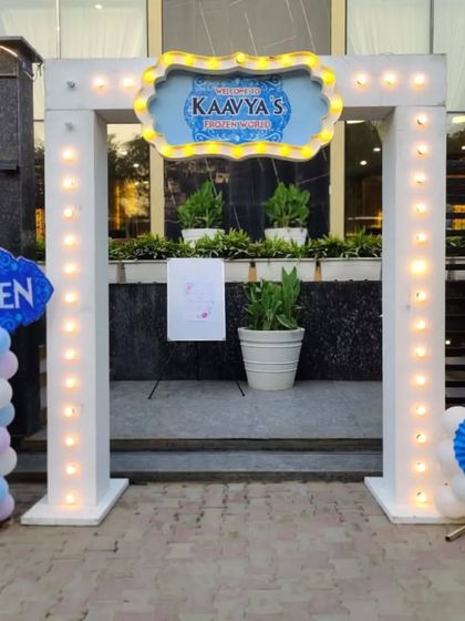 A grand light-up entrance gate for a Frozen-themed party, setting a magical tone from the start.