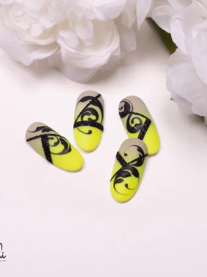 A static shot of the neon yellow and black swirl designs, allowing for a closer look at the details.