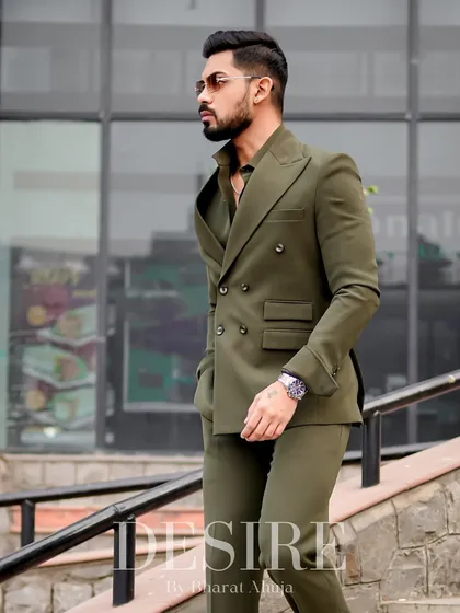 The double-breasted suit is a timeless symbol of power. I crafted this one in a deep olive green, tailored for a flawless fit that exudes confidence and classic style.