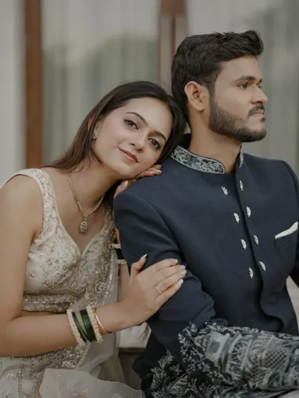A close-up couple shot showing her glowing skin and the subtle elegance of her engagement look.