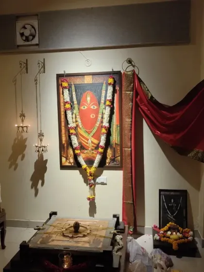 A volunteer carefully lights the 11 brass lamps on the wall next to the Devi Yantra. This is a key part of our Abhishekam ritual, symbolizing the 11 aspects of Devi's energy.