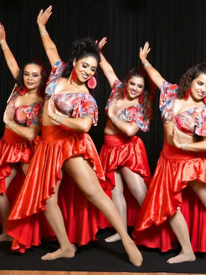 This is my amazing All-Girls Salsa crew. We train together, support each other, and bring our collective power to the stage. Our group performance training is about building skills and a dance family.