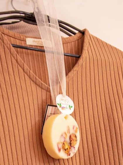 Here’s one of my scented wax tablets in action, hanging in a closet to keep clothes smelling fresh. They are a simple and beautiful way to bring fragrance to small spaces.