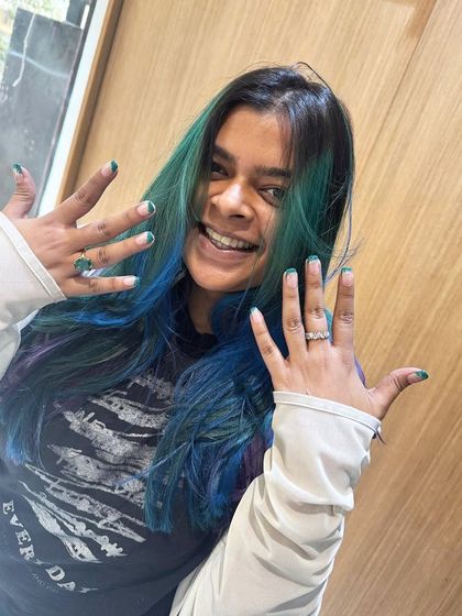 A happy client showing off her new hair and matching nails. I love seeing the joy that a fresh look can bring. Her smile says it all.