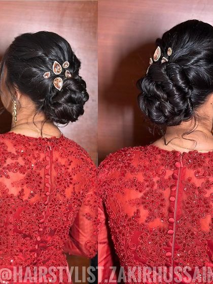 An elegant braided updo accented with jeweled clips. This style is perfect for a cocktail party or a formal reception, adding a touch of sparkle to a red gown.
