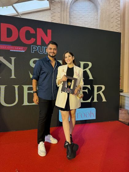 Posing on the red carpet with my DCN Star Influencer award. I'm so grateful for the recognition and for everyone who has supported me on this journey.