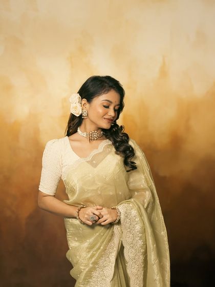 This shot captures a moment of quiet elegance, with the jewellery adding a subtle sparkle.