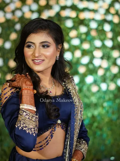 A candid, happy moment. The makeup is designed to look just as good in candid shots as it does in posed portraits, capturing your natural joy.