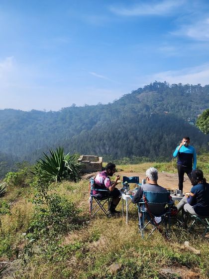 Enjoying a well-deserved breakfast break overlooking the hills of Yercaud. Our support vehicle ensures you have everything you need for a comfortable and enjoyable ride.