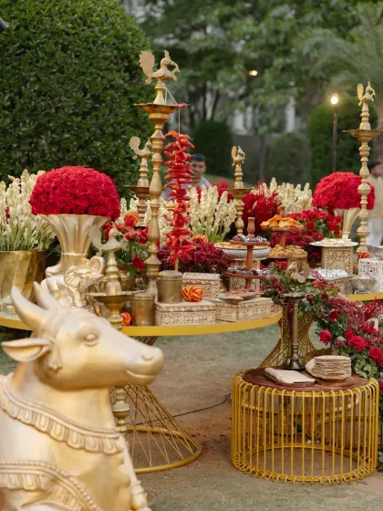 A prasad and offerings table from the Shiva-Parvati themed wedding. Every detail, including the golden Nandi statue and traditional brass lamps, was curated to align with the sacred and devotional atmosphere of the ceremony.