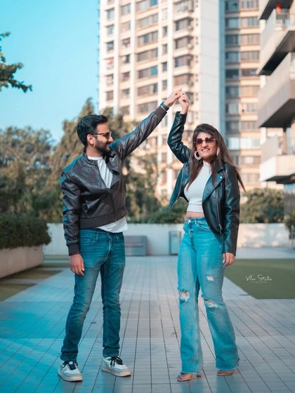 A duplicate of image 148, this action shot is full of movement and joy, perfectly capturing the dynamic energy of the couple and the city.