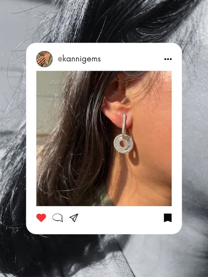 Some pieces do not just complete your look, they become a part of who you are. This image, styled like a social media post, features a stunning diamond pendant and solitaire ring.