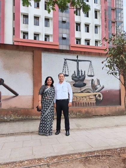 Outside the Belapur court with a colleague. Every day spent in the corridors of justice is a step towards making a difference.