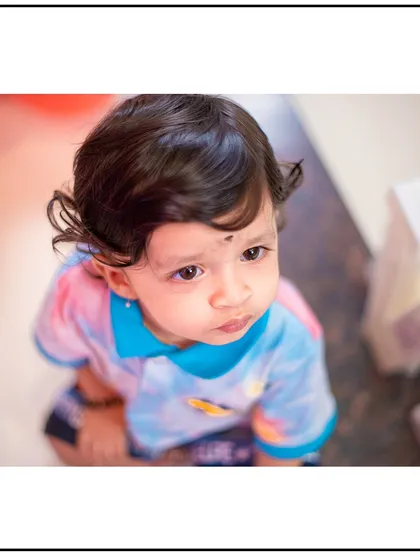 A high-angle shot capturing a thoughtful expression. I vary my perspectives to create a dynamic and interesting gallery for you.