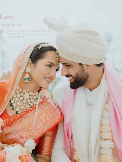 A classic, happy portrait of the couple on their wedding day. Their smiles and the way they look at each other perfectly define the word "Love."
