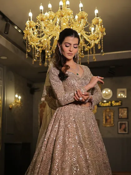 A pensive, elegant pose in the mirror-work lehenga. This outfit is perfect for creating unforgettable moments and photographs.