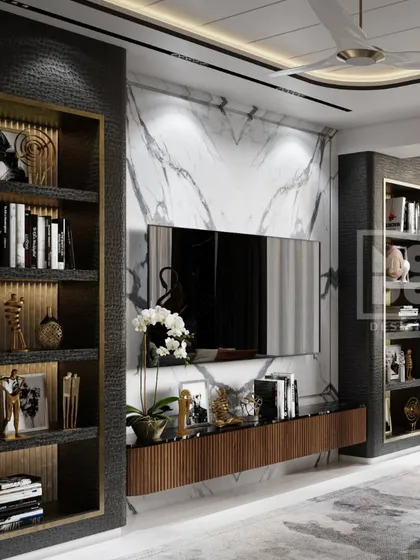 Modern luxury at its finest. This living room showcases a perfect harmony of textures and tones, with black textured shelving, golden highlights, and a stunning marble backdrop for a timeless, elegant vibe.