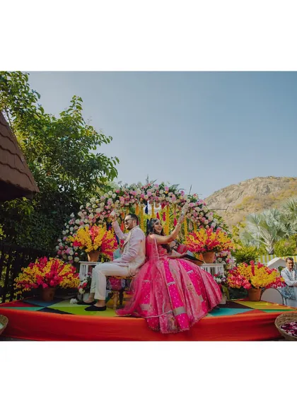 A fun and vibrant carnival event at a Pushkar resort. We capture the colorful decor, the joyful atmosphere, and the stunning mountain backdrop of your destination wedding festivities.
