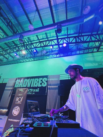 Another shot of me at the decks during the BadVibes event in Thailand. The lighting and atmosphere were perfect for an underground hip hop battle.