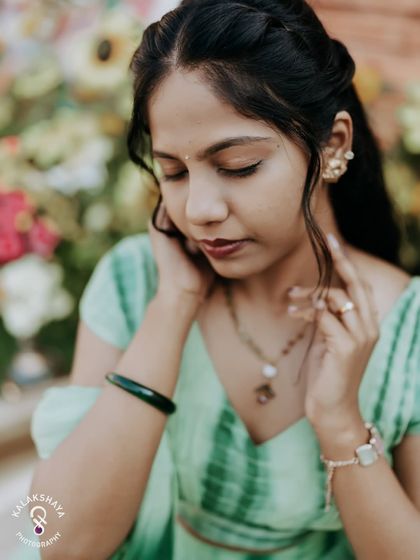 A quiet, contemplative portrait of the bride during her Haldi ceremony.
