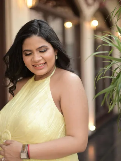A gentle smile from the mom-to-be. The soft brown eyes and natural bronzer create a warm and gentle look, perfect for celebrating this special time.