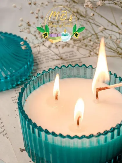 The glow from a three-wick candle is something special. This one, in a bright teal crystal jar, is filled with my Citron Blossom fragrance, a refreshing blend of tuberose, honey, and lemon.