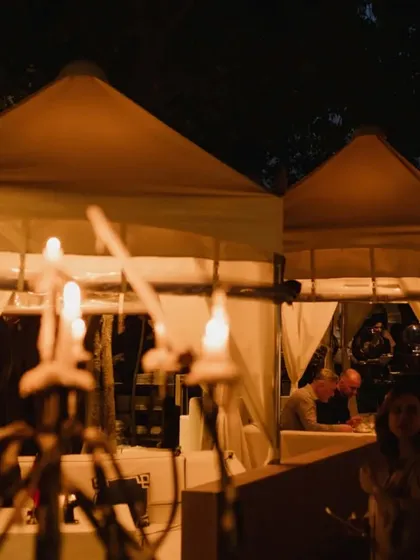 Even during a bustling event, the intimate feel of our cabanas remains, offering guests a private space to enjoy the evening.