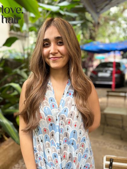 The happy client reveal of her burnished bronde look. The colour is bright, sunny, and perfectly complements her features.