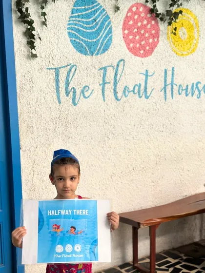 Halfway there and loving it. This young swimmer marks her progress in our coaching program, building skills and confidence with each lesson.
