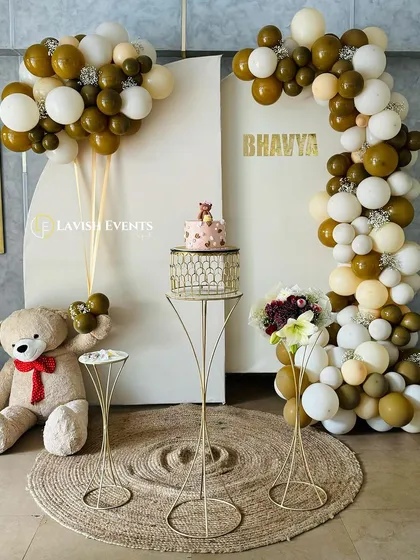 A charming teddy bear themed birthday setup with an earthy brown and white color scheme.