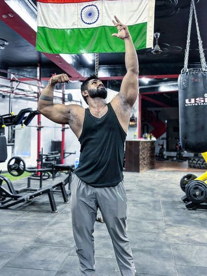 A classic victory pose under the Indian flag. This is for my country, my team, and myself.