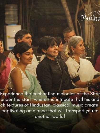 An audience ready to experience the enchanting melodies of the sitar. The starlit, open-air setting promises a captivating ambiance that transports you to another world.