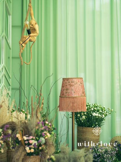 A detail of the decor, featuring a playful monkey lamp hanging from the ceiling.