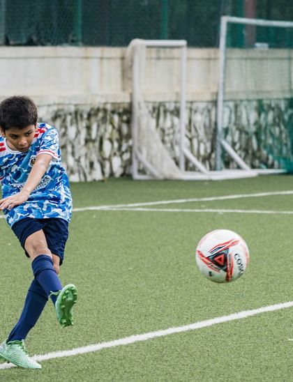 A clean strike of the ball. We focus on teaching proper shooting technique to turn our players into confident goal scorers.