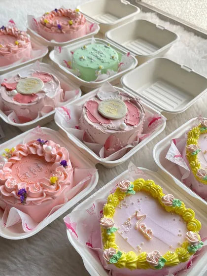 A collection of my Mother's Day bento cakes. I used lots of pinks, florals, and delicate details to make them extra special for all the moms.