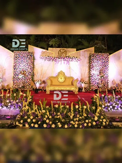For this grand evening reception in Bengaluru, I created a multi-panel stage with dense floral walls and dramatic uplighting. The elegant gold sofa and intricate flower arrangements provided a luxurious focal point for the couple.