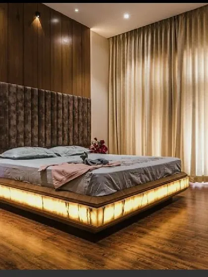We love adding unique elements to our designs, like this custom bed with an illuminated onyx stone base. This feature provides a warm, ambient glow, turning the bed into a stunning centerpiece while showcasing our expertise in custom furniture design.